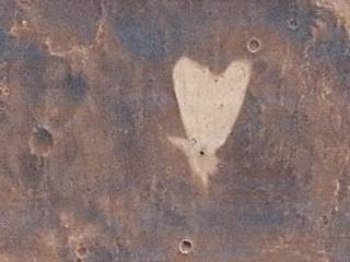 This picture of a heart-shaped feature in Arabia Terra on Mars was taken on May 23, 2010, by the Context Camera (CTX) on NASA's Mars Reconnaissance Orbiter.