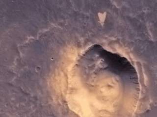 This picture of a heart-shaped feature in Arabia Terra on Mars was taken on May 23, 2010, by the Context Camera (CTX) on NASA's Mars Reconnaissance Orbiter.