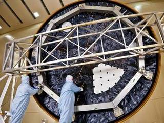 Technicians at Lockheed Martin Space Systems, Denver, prepare the heat shield for NASA's Mars Science Laboratory, in this April 2011 photo. With a diameter of 4.5 meters (nearly 15 feet), this heat shield is the largest ever built for a planetary mission.