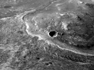 This oblique view with moderate vertical exaggeration shows the portion of the rim of Endeavour crater given the informal name "Spirit Point."  This is the location where the team operating NASA's Mars Exploration Rover Opportunity plans to drive the rover to its arrival at the Endeavour rim.