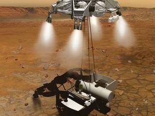 This artist's concept of a proposed Mars sample return mission portrays a rocket-powered descent stage lowering a sample-retrieving rover and an ascent vehicle to the surface.