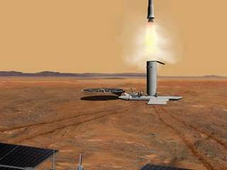 This artist's concept of a proposed Mars sample return mission portrays the launch of an ascent vehicle. The solar panels in the foreground are part of a rover.
