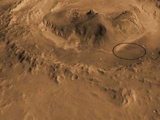 This computer-generated view based on multiple orbital observations shows Mars' Gale crater as if seen from an aircraft north of the crater.