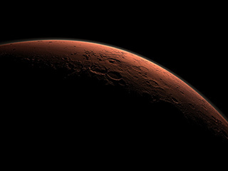 This computer-generated view depicts part of Mars at the boundary between darkness and daylight, with an area including Gale Crater beginning to catch morning light.