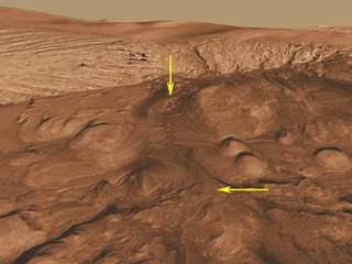 This oblique view of the mound in Gale Crater shows several different rock types of interest to the Mars Science Laboratory mission.