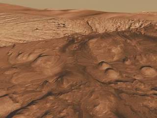 This oblique view of the mound in Gale crater shows several different rock types of interest to the Mars Science Laboratory mission.