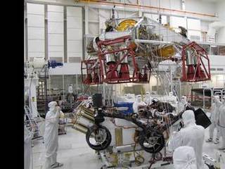 Spacecraft specialists test the descent stage and rover of the Mars Science Laboratory in this scene from the Spacecraft Assembly Facility at NASA's Jet Propulsion Laboratory, Pasadena, Calif.