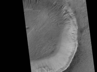 This image contrasts gullies and recurring warm-season slope flows appearing in the same crater, in the middle southern latitudes of Mars.
