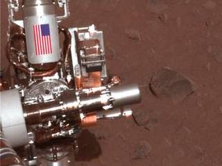 The piece of metal with the American flag on it in this image of a NASA rover on Mars is made of aluminum recovered from the site of the World Trade Center towers in the weeks after their destruction.