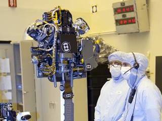 Technicians at the Payload Hazardous Servicing Facility at NASA's Kennedy Space Center in Florida, put the instrument mast and science boom on NASA's Mars Science Laboratory (MSL) rover, known as Curiosity, through a series of deployment tests.