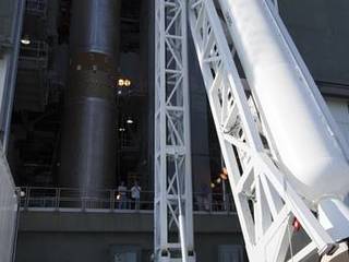 At the Vertical Integration Facility at Space Launch Complex 41 on Cape Canaveral Air Force Station in Florida, technicians use a lifting device to elevate a solid rocket motor (SRM) into an upright position for mating to a United Launch Alliance Atlas V rocket which will carry NASA's Mars Science Laboratory (MSL) mission.