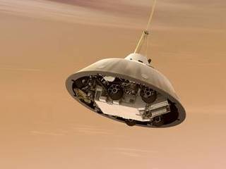 This is an artist's concept of NASA's Curiosity rover tucked inside the Mars Science Laboratory spacecraft's backshell while the spacecraft is descending on a parachute toward Mars.