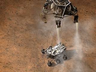 This artist's concept depicts the moment immediately after NASA's Curiosity rover touches down onto the Martian surface.