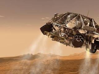 This is an artist's concept of the rover and descent stage for NASA's Mars Science Laboratory spacecraft during the final minute before the rover, Curiosity, touches down on the surface of Mars.