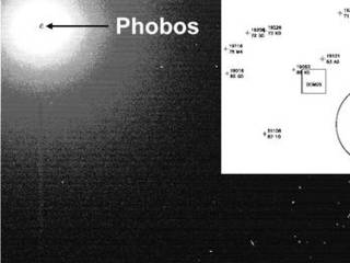 The insert in this image is a simulation of what the Mars Reconnaissance Orbiter's optical navigation camera images of the Martian moons Phobos and Deimos will look like. The images will not be up-close portraits of the moon like we have from the Viking missions. They will be contextual pictures that will aid navigators in getting the most specific location data, so they know exactly where the Mars Reconnaissance Orbiter spacecraft is before its orbit insertion.