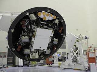 At the Payload Hazardous Servicing Facility at NASA's Kennedy Space Center in Florida, the "back shell powered descent vehicle" configuration of NASA's Mars Science Laboratory is being rotated for final closeout actions.
