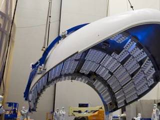 In the Payload Hazardous Servicing Facility at NASA's Kennedy Space Center in Florida, the fairing acoustic protection (FAP) system lining the inside of the Atlas V payload fairing for NASA's Mars Science Laboratory (MSL) mission comes into view as the fairing is lifted into a vertical position.