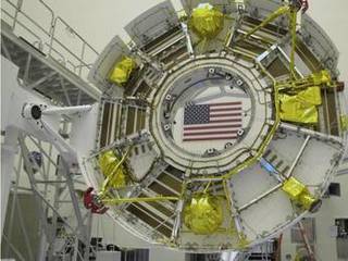 The cruise stage of NASA's Mars Science Laboratory spacecraft is being prepared for final stacking of the spacecraft in this photograph from inside the Payload Hazardous Servicing Facility at NASA Kennedy Space Center, Fla.