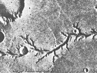 This view of channels on Mars came from NASA's Mariner 9 orbiter. In 1971, Mariner 9 became the first spacecraft to enter orbit around Mars.