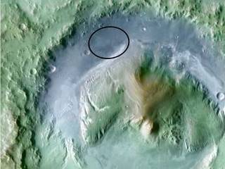 Color coding in this image of Gale Crater on Mars represents differences in elevation, with blue relatively low and tan relatively high.