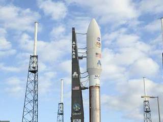 The 197-foot-tall United Launch Alliance Atlas V rocket seems surrounded by lightning masts as it arrives at the launch pad at Space Launch Complex 41 on Cape Canaveral Air Force Station in Florida. Atop the rocket is NASA's Mars Science Laboratory (MSL), enclosed in its payload fairing.