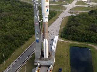 Backdropped by the Atlantic Ocean, the 197-foot-tall United Launch Alliance Atlas V rocket rolls toward the launch pad at Space Launch Complex 41 on Cape Canaveral Air Force Station in Florida. Atop the rocket is NASA's Mars Science Laboratory (MSL), enclosed in its payload fairing.