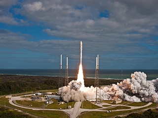 NASA's Mars Science Laboratory spacecraft, sealed inside its payload fairing atop the United Launch Alliance Atlas V rocket, clears the tower at Space Launch Complex 41 on Cape Canaveral Air Force Station in Florida.