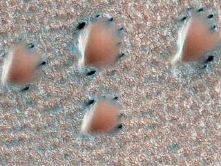 This scene is from early spring in the northern hemisphere of Mars. These dunes are covered with a layer of seasonal carbon dioxide ice (dry ice).
