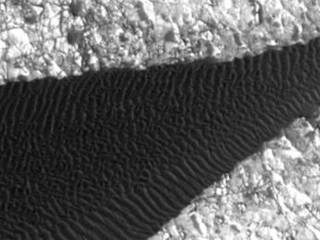 Back-and-forth blinking of this two-image animation shows movement of ripples covering a sand dune on Mars.