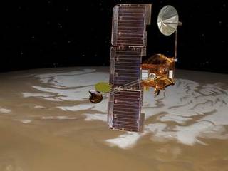 NASA's Mars Odyssey spacecraft passes above Mars' south pole in this artist's concept illustration. The spacecraft has been orbiting Mars since October 24, 2001.