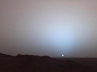 On May 19th, 2005, NASA's Mars Exploration Rover Spirit captured this stunning view as the Sun sank below the rim of Gusev crater on Mars.