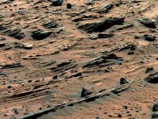 Spirit examined spectacular layered rocks exposed at "Home Plate."