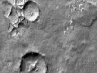Continuing our survey of non-crater dune fields brings us to this group of dunes in Aonia Terra. The daytime IR illustrates the warmth of the dune material compared to the surrounding materials.