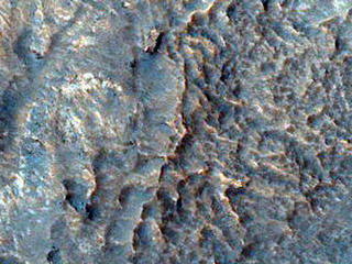 Gullied Crater Slope with Rocky Outcrops Northeast of Hellas Region