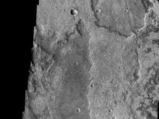 Just as on Earth, volcanism and tectonism are found together on Mars. Here is an example: the ridges and fractures of Claritas Fossae are affecting or perhaps hosting the volcanic flows of Solis Planum.