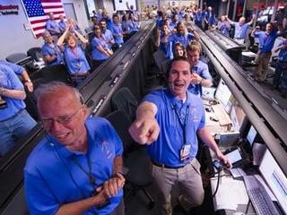 The Mars Science Laboratory (MSL) team in the MSL Mission Support Area react after learning the the Curiosity rove has landed safely on Mars and images start coming in at the Jet Propulsion Laboratory on Mars, Sunday, Aug. 5, 2012 in Pasadena, Calif. The MSL Rover named Curiosity was designed to assess whether Mars ever had an environment able to support small life forms called microbes.