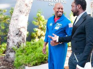 Astronaut, Leland Melvin escorts Will.i.am into JPL at the beginning of the Curiosity Landing Night event.