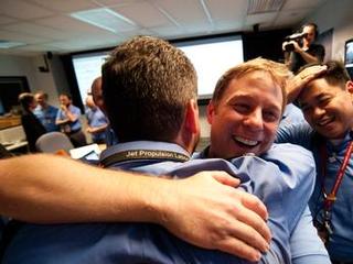 The Entry, Descent and Landing team celebrate just moments after news that Curiosity landed safely on Mars.
