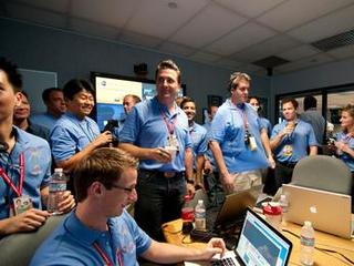 The Entry, Descent and Landing team gathers to celebrate prior to a post-landing press briefing.