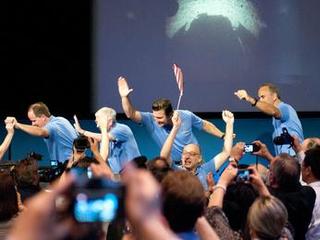 The Curiosity rover's Entry, Descent and Landing team (EDL) arrives at the post-landing press conference to cheers and celebration.