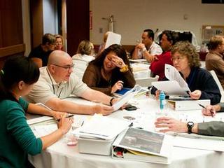 A group of teachers discusses solutions to a problem-solving activity at the Aug. 5, 2012, Curiosity Educator Workshop at NASA's Jet Propulsion Laboratory in Pasadena, Calif.