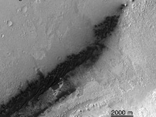These images from NASA's Mars Reconnaissance Orbiter (MRO) show a before-and-after comparison of the area where NASA's Curiosity rover landed on Aug. 5 PDT (Aug. 6 EDT).