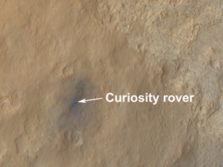 This color-enhanced view shows the terrain around the rover's landing site within Gale Crater on Mars.