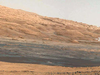 This image (cut out from a mosaic) shows the view from the landing site of NASA's Curiosity rover toward the lower reaches of Mount Sharp, where Curiosity is likely to begin its ascent through hundreds of feet (meters) of layered deposits.