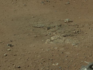 This cropped image from NASA's Curiosity rover shows one set of marks on the surface of Mars where blasts from the descent-stage rocket engines blew away some of the surface material.