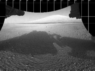 The Curiosity engineering team created this view from images taken by NASA's Curiosity rover front hazard avoidance cameras underneath the rover deck on Sol 0.