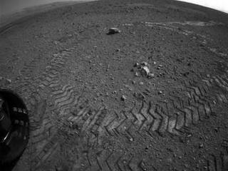 This image shows the tracks left by NASA's Curiosity rover on Aug. 22, 2012, as it completed its first test drive on Mars.