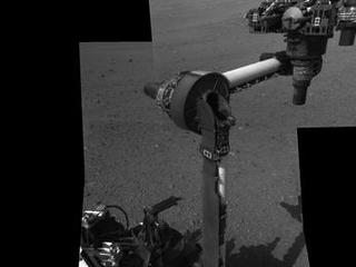 The extended robotic arm of NASA's Mars rover Curiosity can be seen in this mosaic of full-resolution images from Curiosity's Navigation camera (Navcam). Curiosity extended its arm on Aug. 20, 2012.