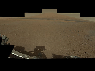 This color panorama shows a 360-degree view of the landing site of NASA's Curiosity rover, including the highest part of Mount Sharp visible to the rover. That part of Mount Sharp is approximately 12 miles (20 kilometers) away from the rover. .