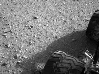 Soil clinging to the right middle and rear wheels of NASA's Mars rover Curiosity can be seen in this image taken by the Curiosity's Navigation Camera after the rover's third drive on Mars.